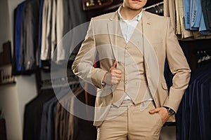 Cropped image of young man buttoning his jacket. successful businessman