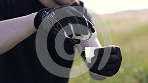 Cropped photo hands of farmer in garden gloves holds and mixes poison, herbicide or pesticide liquid for protecting