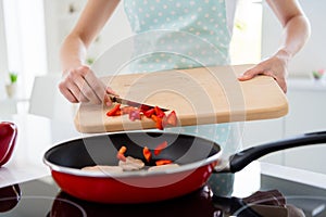 Cropped photo of housewife hands holding cutting wooden board checking meat condition adding fresh pepper cooking tasty