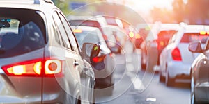 Cropped photo of a line of cars on highway in traffic jam on city street