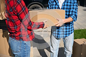 Cropped photo of man hands giving box to woman hands