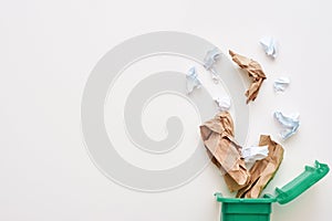 Cropped photo of paper trash. Crumple paper falling to the recycling bin