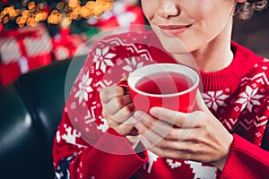 Cropped photo picture of smiling cute lady drinking raspberry tea new year atmosphere tradition warmth isolated on blur