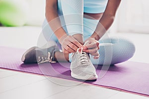 Cropped photo of slender sporty woman sportswear tie sneakers preparing cardio training indoors house apartment room