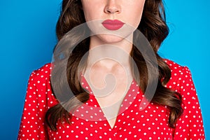 Cropped photo of young attractive beautiful woman with red lipstick pomade wear red dotted dress isolated on blue color