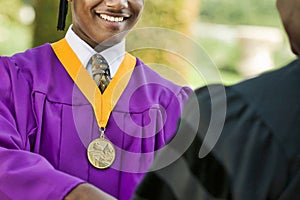 Cropped photo of Young Man Graduating with medal