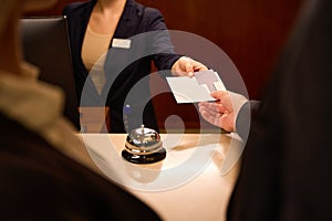 Cropped picture of female hand giving keycard to man hand