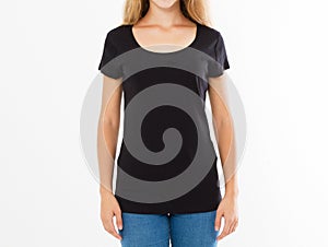 Cropped portrait of young blond woman with beautiful slim body wearing black T-shirt with copy space for your text or advertising