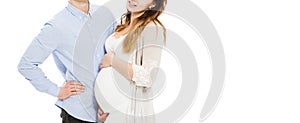 Cropped Portrait of a young pregnant couple on a white background isolated photo