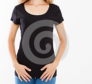 Cropped portrait of young white girl with beautiful slim body wearing black tshirt with copy space for your text or advertising