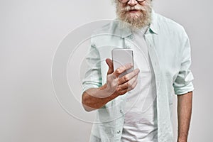 Cropped of senior man use and watch smartphone