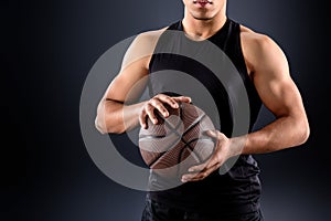 cropped shot of african american basketball player with ball