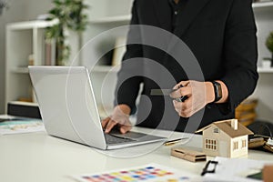 Cropped shot architect developing project concepts and analyzing design options in the office