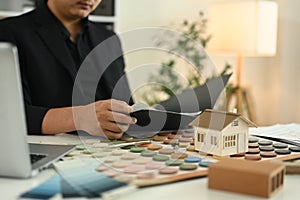 Cropped shot architect developing project concepts and analyzing design options in the office