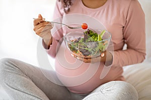 Cropped Shot Of Black Pregnant Lady Eacting Fresh Vegetable Salad At Home