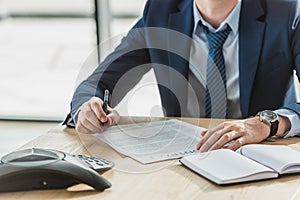 cropped shot of businessman signing contract