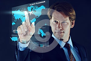 Cropped shot of a businessman touching a holographic map.All screen content is designed by us and not copyrighted by