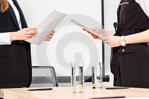 cropped shot of businesswomen with documents