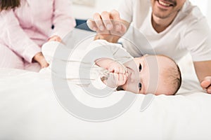 Cropped shot of cute baby and parents