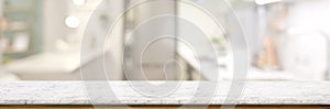 Cropped shot of empty marble table in blurred kitchen room