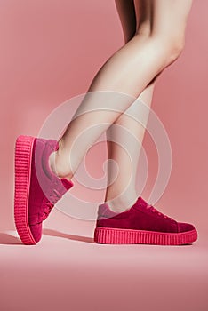 cropped shot of girl in stylish sneakers
