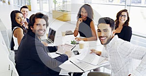 Cropped shot of a group of businesspeople sitting around the boardroom table during a meeting