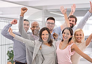 Let& x27;s celebrate success. Cropped shot of a group of businesspeople smiling and raising their hands.