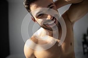 Cropped shot of handsome smiling man with beard