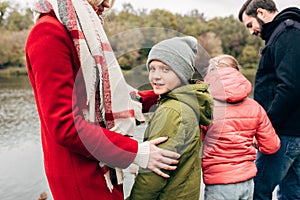 cropped shot of happy young family with two children