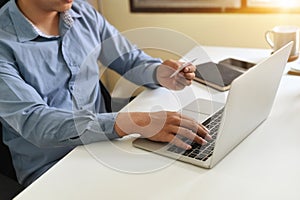 Cropped shot of man input credit card information while shopping online