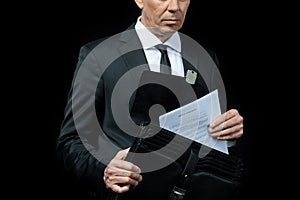 Cropped shot of mature businessman holding briefcase with papers