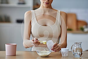 Mom Preparing Baby Formula at Table