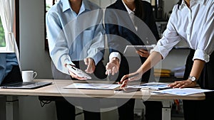 Cropped shot, Professional Asian financial analysts working together