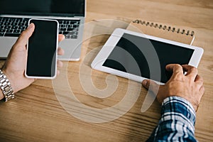 cropped shot of seo professional using different gadgets