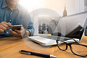 Cropped shot Silhouette of a man's hands using a laptop at home,