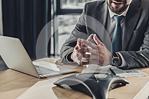 cropped shot of smiling businessman