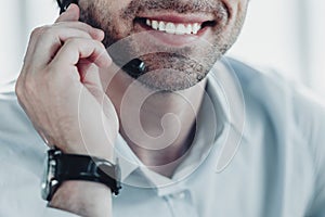 cropped shot of smiling support hotline worker