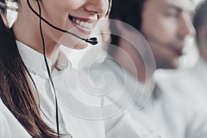 cropped shot of smiling young call center manageress working