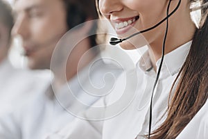 cropped shot of smiling young call center manageress working