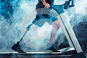 cropped shot of sportsman with leg prosthesis training