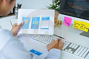 Cropped shot of startup UX UI front end designers developing programming and coding responsive web content or mobile application