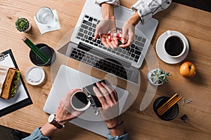 cropped shot of stressed businesspeople with pills and alcohol