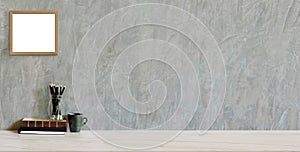 Cropped shot of trendy workplace with copy space and office supplies on marble background and loft grey wall