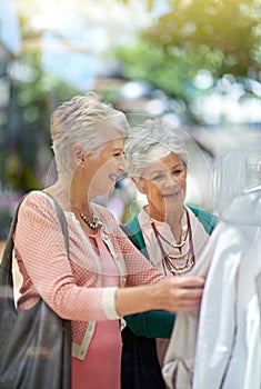 This is a great deal. Cropped shot of a two senior women out on a shopping spree.