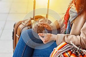 Cropped shot view of woman tourist holding gadget tablet with navigation application and planned route on the screen, female looki