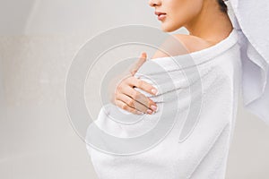 cropped shot of woman in bathrobe