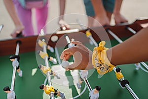 Woman holding ball for table football