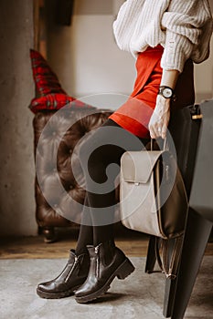 Cropped shot of woman holding black bag