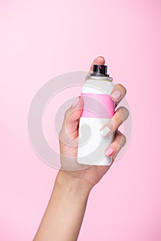 cropped shot of woman holding can of spray paint for hair