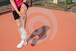 Cropped shot of woman runner suffering from knee pain. It often happens when your kneecap is out of alignment.